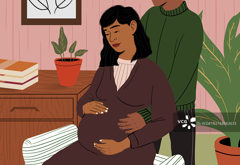 男子触摸坐在椅子上的孕妇的肚子图片素材