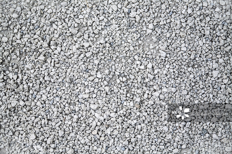 花岗岩砾石纹理背景。自然色。特写图片素材