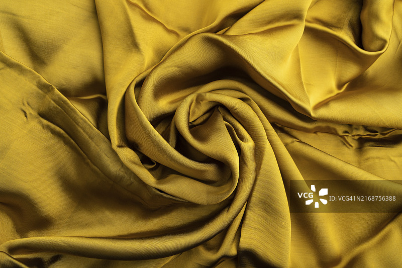 黄绿色纸巾碎片。侧视图，合成纺织品背景和纹理。波浪概念，抽象图片素材