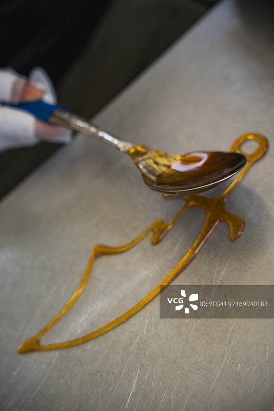 广州非物质文化遗产手工食品糖画图片素材