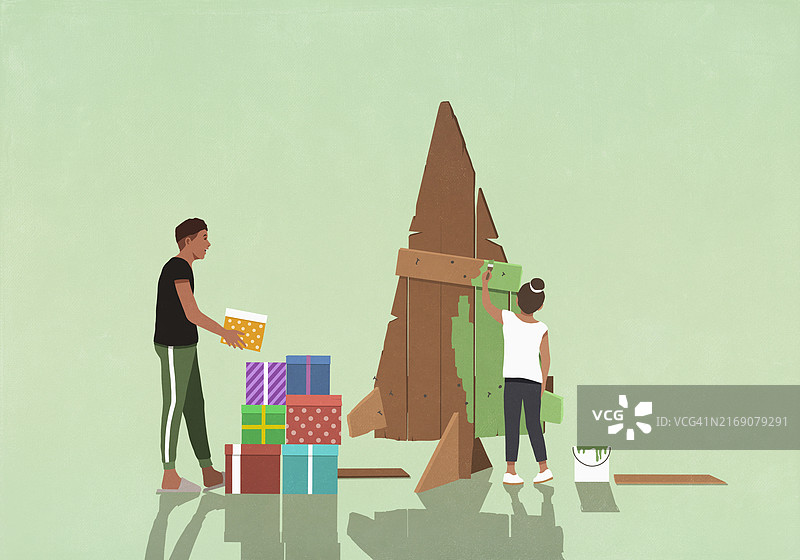 为圣诞树用绿色油漆木头的送礼夫妇图片素材