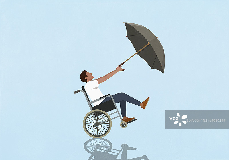 蓝色背景下手持雨伞的轮椅男子图片素材