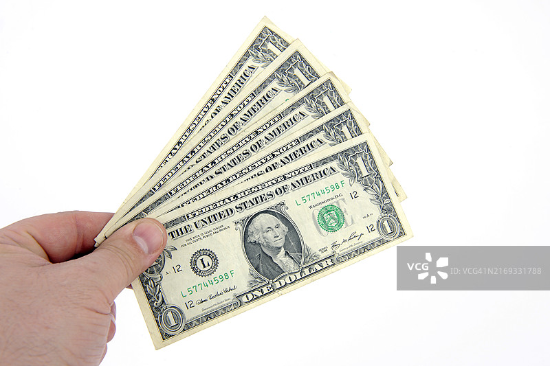 手中展开的扇形一美元纸币图片素材