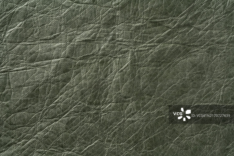 牛皮纸纹理的绿色环保人造皮革背景图片素材