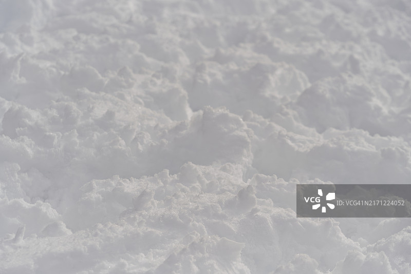白色雪地的纹理与脚印图片素材