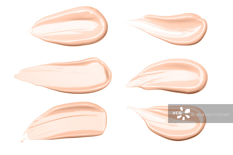六种米色粉底涂抹，具有光滑和纹理的饰面。护肤和美容的概念。含有肽、益生元、神经酰胺、壬二酸、视黄醇分子的护理化妆品。图片素材