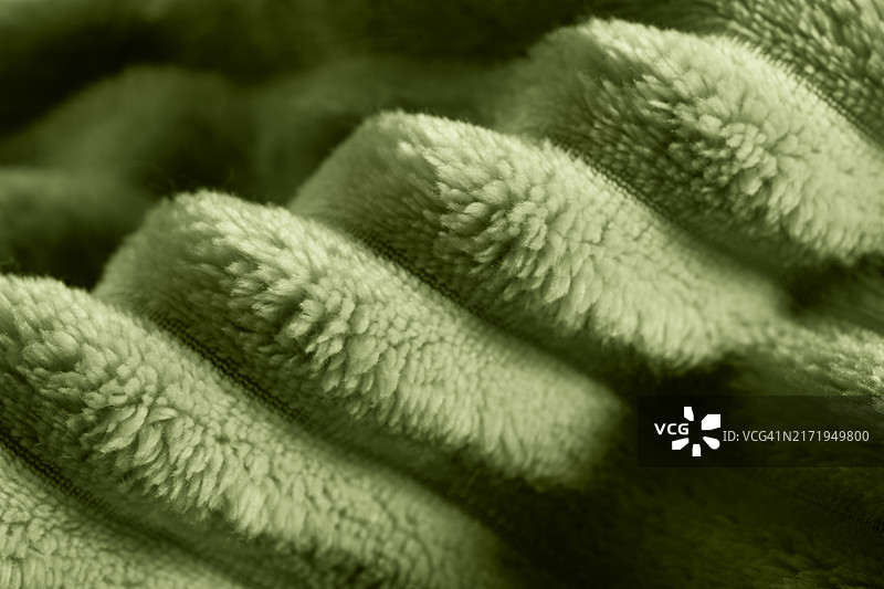 潮流绿色系的蓬松柔软毯子或纺织品背景图片素材