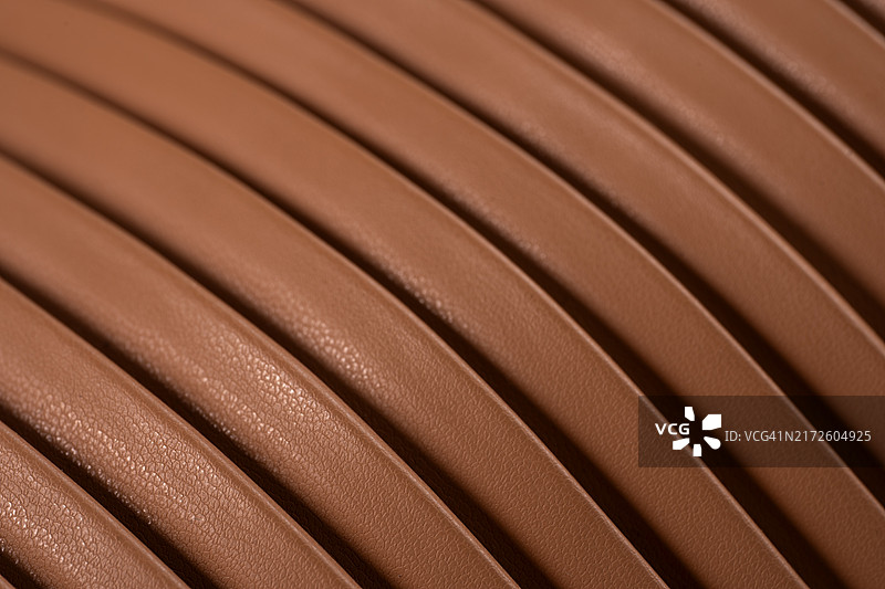 棕褐色女士时尚皮包表面背景，黑色星期五时尚概念图片素材