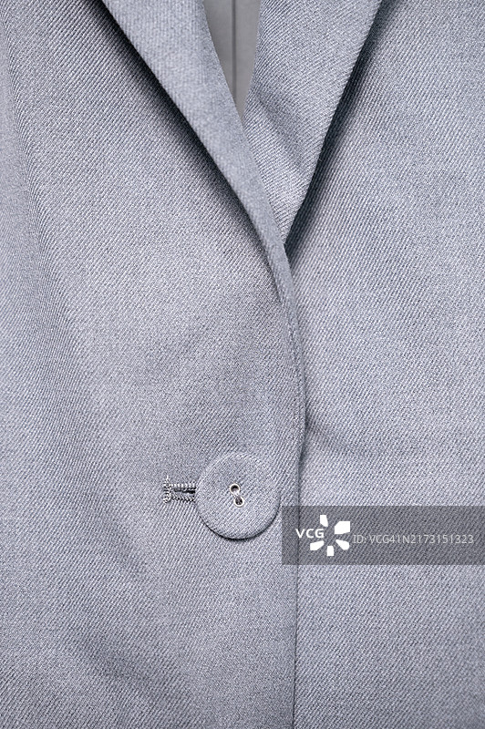 灰色西装面料及纽扣特写图片素材