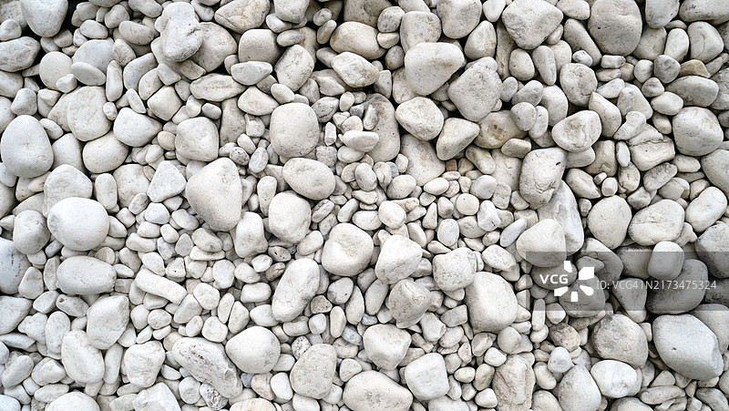 葡萄牙波尔图地面上的白色鹅卵石特写图片素材