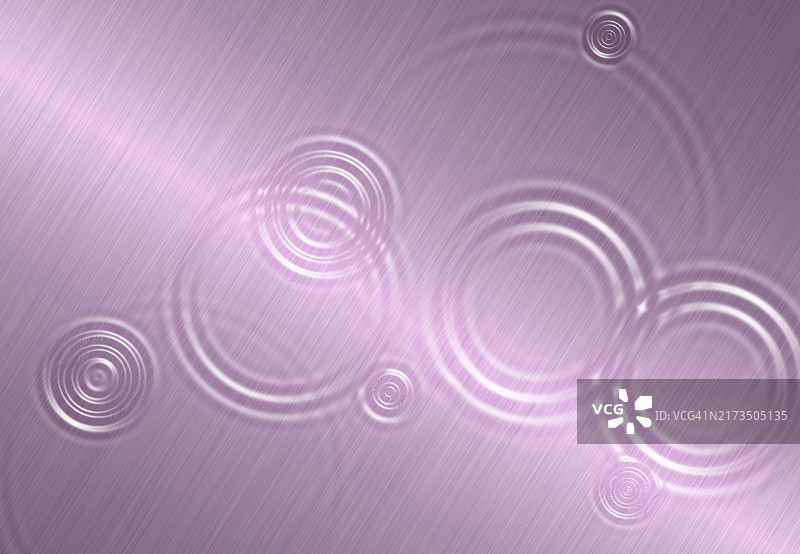粉色金属背景上的水波同心圆特写图片素材
