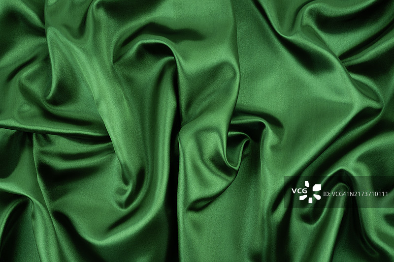 绿色丝绸布料褶皱纹理特写图片素材