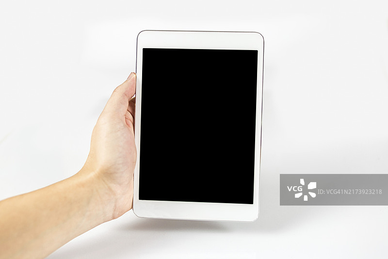白色背景上手持数字平板电脑照片图片素材