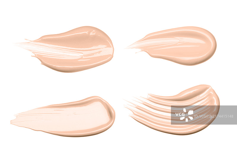 四种米色粉底涂抹，具有光滑和纹理饰面。奶油质地突出了产品的均匀涂抹和融合性。护肤和美容的概念。含肽、益生元、神经酰胺、壬二酸、视黄图片素材
