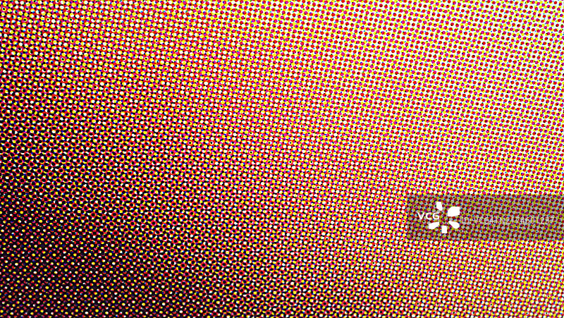 白色背景上黄色、红色、蓝色和黑色的点的微距摄影。阳光。自然色彩。图片素材