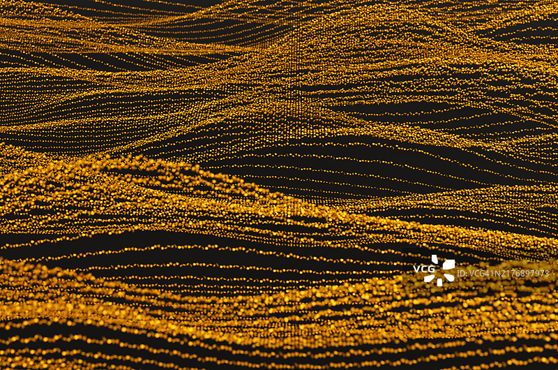 金色岩石上的沙子在风中飘动，形成金色的丝线背景。图片素材