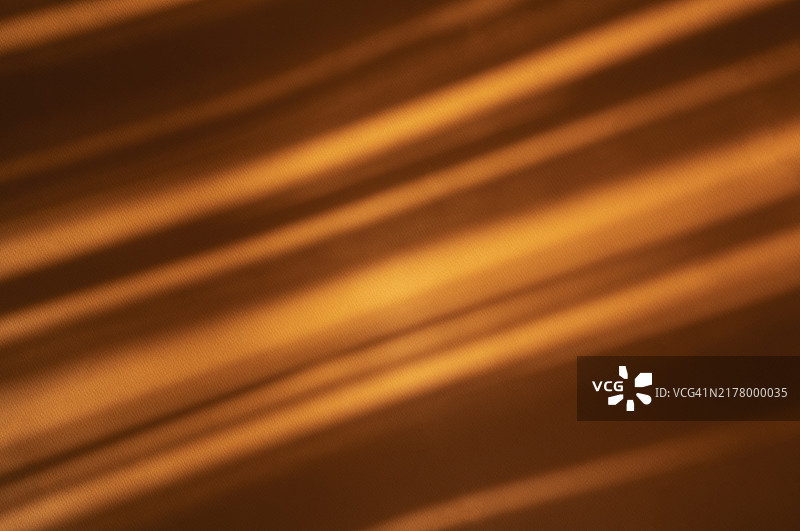 带有阳光和阴影效果的橙色纸背景图片素材