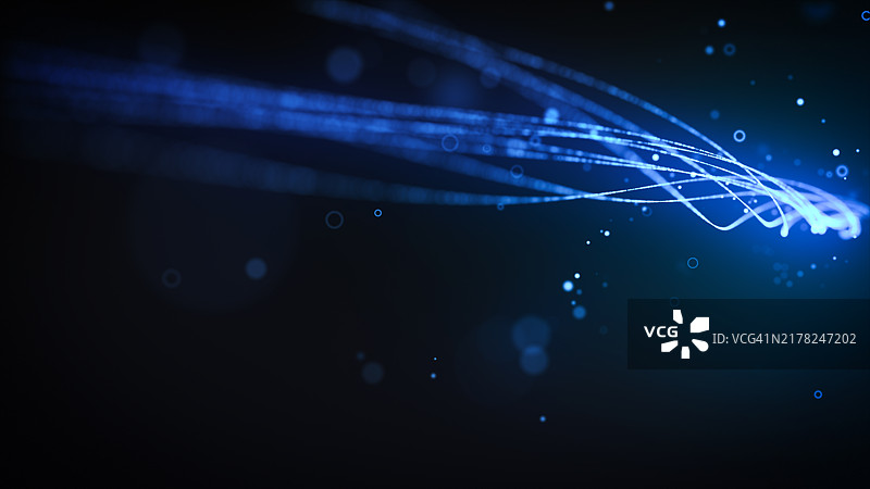 深色背景上的蓝色光迹图片素材