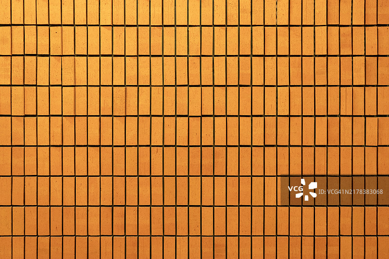 具有矩形图案设计的抽象橙色砖墙图片素材