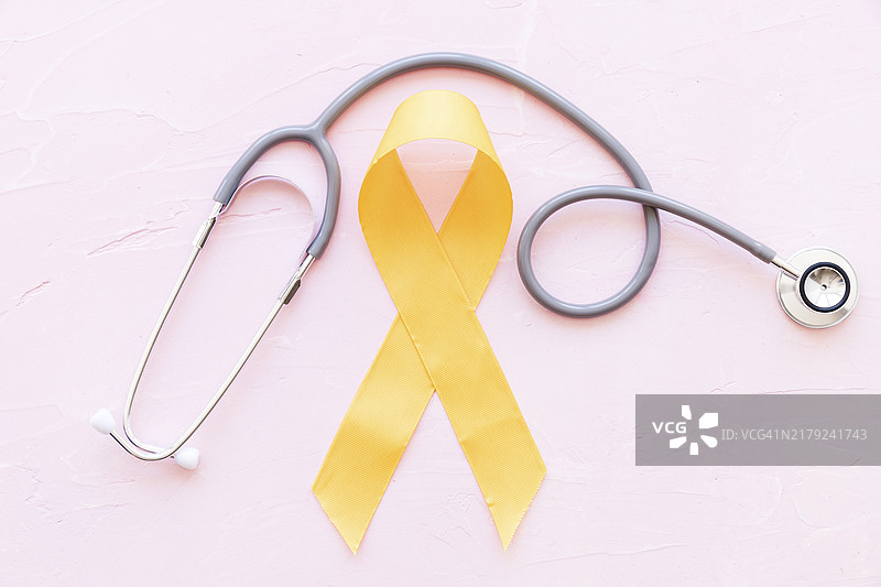 肉瘤骨癌黄丝带听诊器粉色背景图片素材