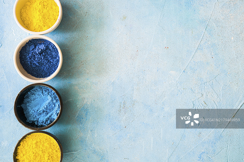 洒红节彩色粉末碗，混凝土彩绘背景图片素材