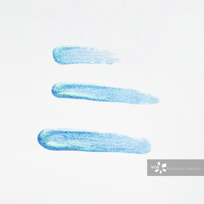 蓝色闪光指甲油白色背景笔触图片素材