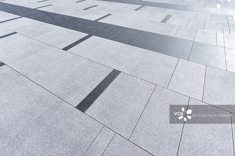 带有几何线条和阴影的纹理石材路面图片素材