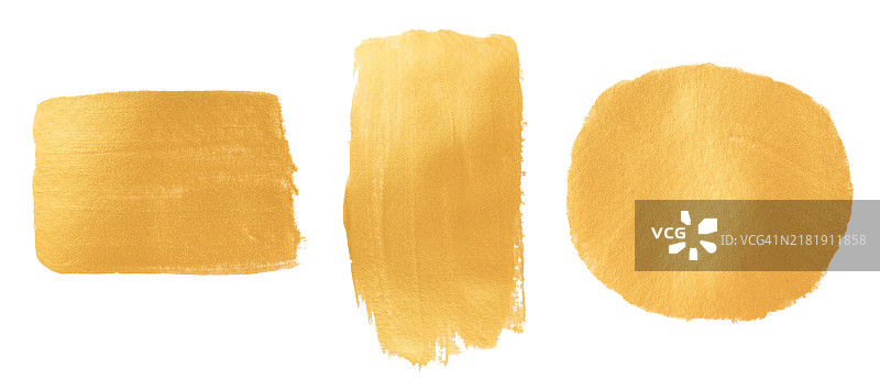 白色背景上的一组金色油漆刷图片素材