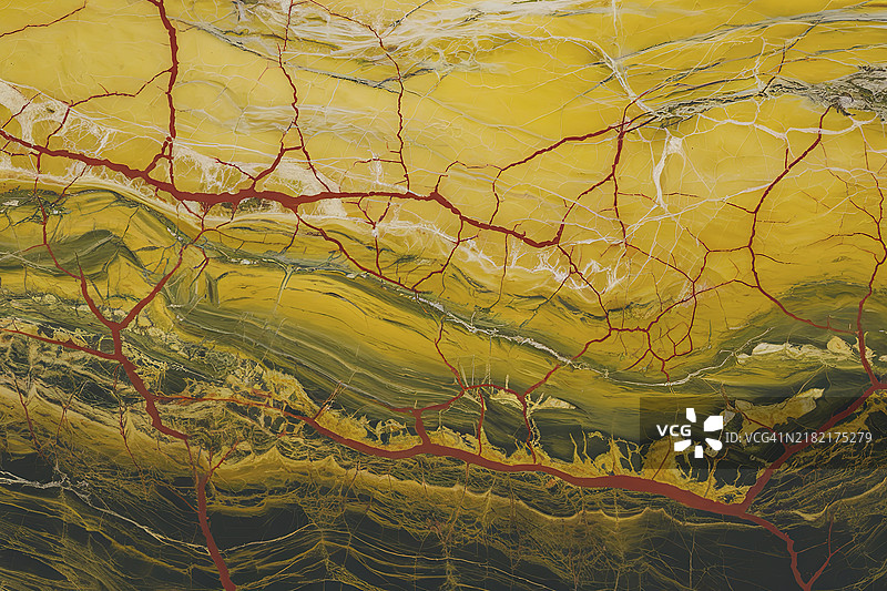 一张大理石纹理的照片，具有复杂的黄色和红色纹路旋转的图案图片素材