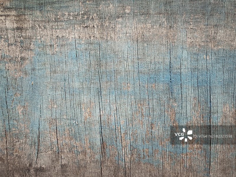 旧木纹与蓝色抽象画。磨损的木板或胶合板表面背景图片素材