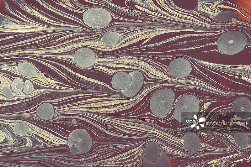 抽象创意的水波纹图案用于面料。Ebru大理石效果表面图案设计用于印刷。图片素材