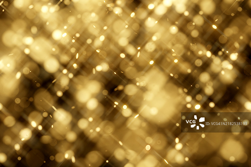 模糊的金色粒子在黑色背景上。节日背景。为您的设计提供节日多彩的背景。圣诞快乐，新年快乐。图片素材