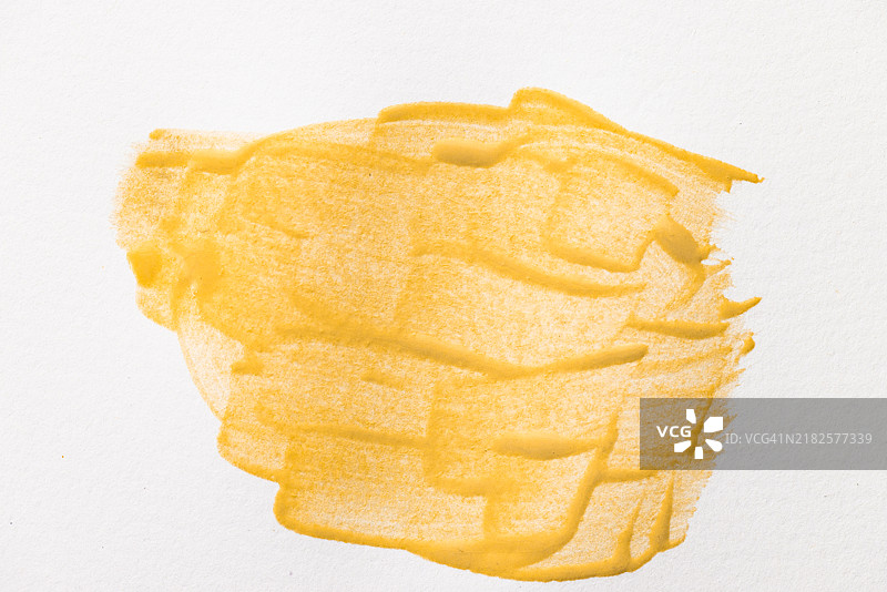 白纸上的黄色颜料图片素材