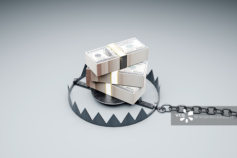 一堆美金与捕熊夹。金融陷阱概念图片素材