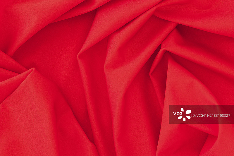 折叠的红色纺织面料纹理背景图片素材
