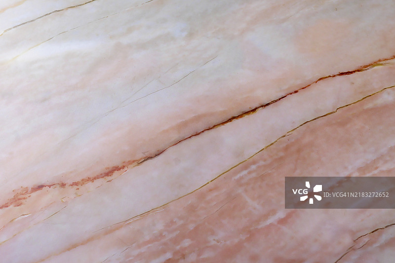 粉白色大理石表面的特写纹理，西班牙马洛卡巴利阿里群岛图片素材