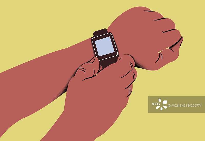 两只手的特写，一只手在黄色背景下为另一只手的手腕上戴上智能手表。图片素材