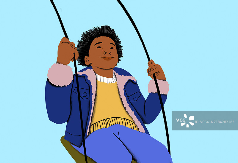 微笑的孩子在蓝色背景下享受秋千的乐趣图片素材