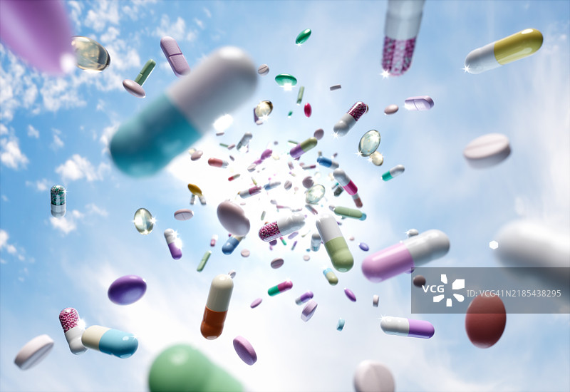 掉落的药丸和胶囊图片素材