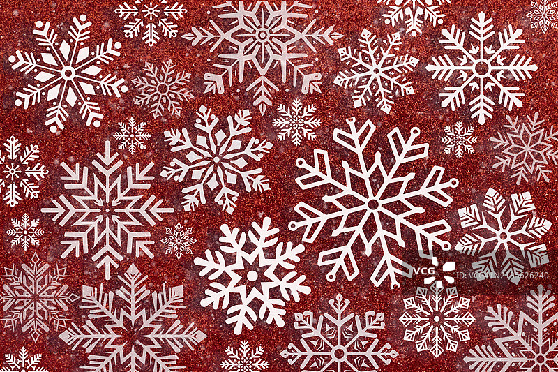闪亮的红色背景与白色雪花图片素材