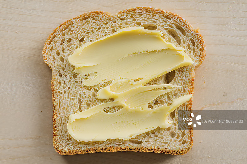 一片涂满黄油的面包特写照片图片素材