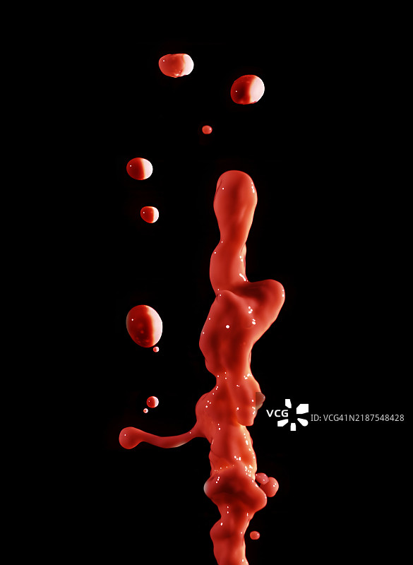 红色颜料在黑色背景上向上流动和滴落。图片素材