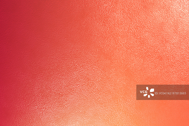 红色和橙色的纹理背景营造出光效图片素材