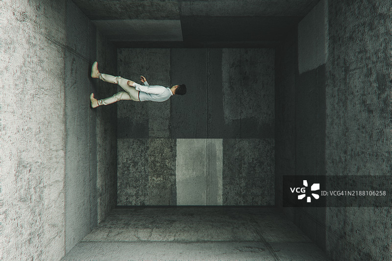 超现实主义的男人在混凝土立方体中行走的图像图片素材