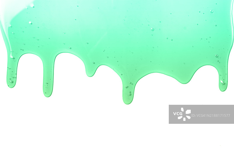 厚厚的薄荷绿色粘液在白色背景上滴落图片素材