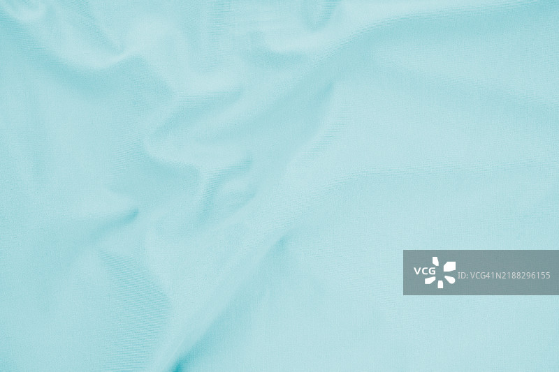 薄荷蓝色织物纺织品。抽象纹理作为背景。图片素材