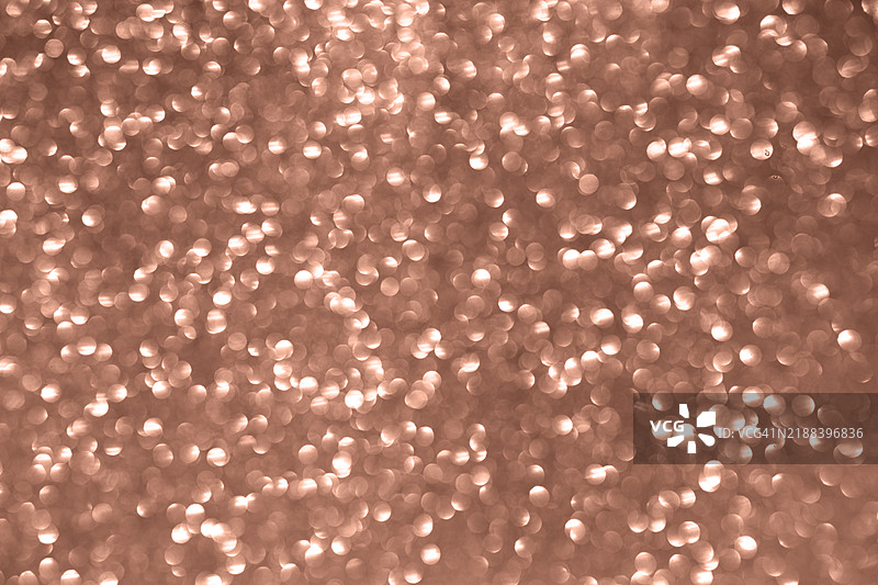 玫瑰金模糊闪烁背景营造节日氛围图片素材