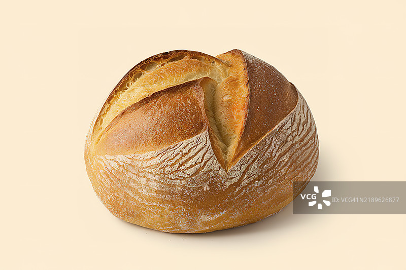 一张金棕色的圆形意大利面包照片图片素材
