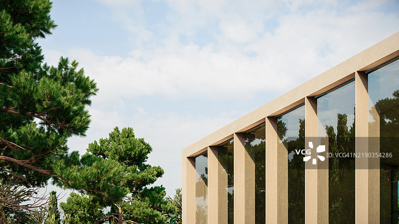 现代豪华别墅的3D细节渲染，周围环绕着树木，采用极简设计，外立面由混凝土、玻璃幕墙和木百叶窗构成。图片素材