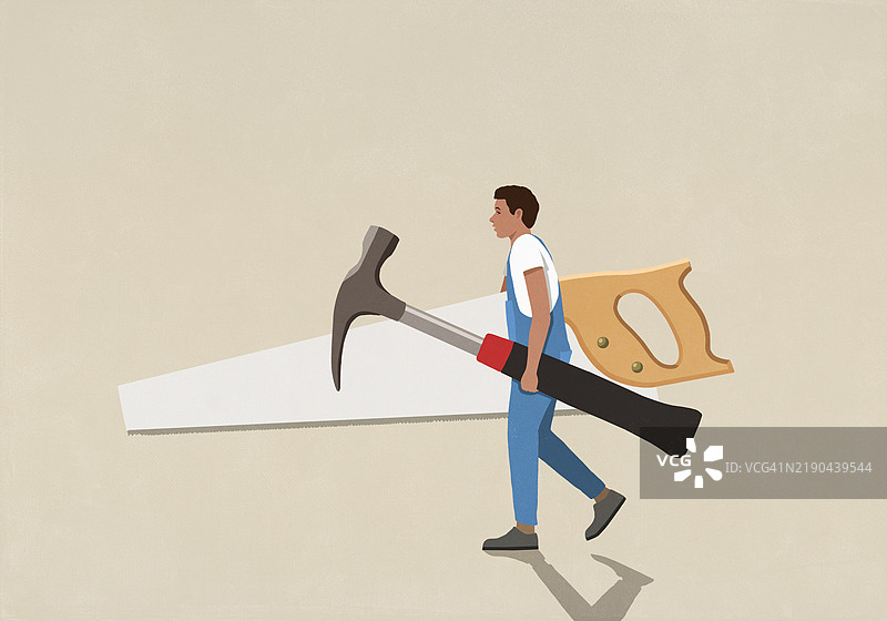 穿着工装的DIY男士在米色背景下携带大型工具图片素材